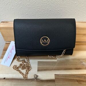iMarilyn Monroe brand crossbody clutch handbag in black with a gold-tone "MM"